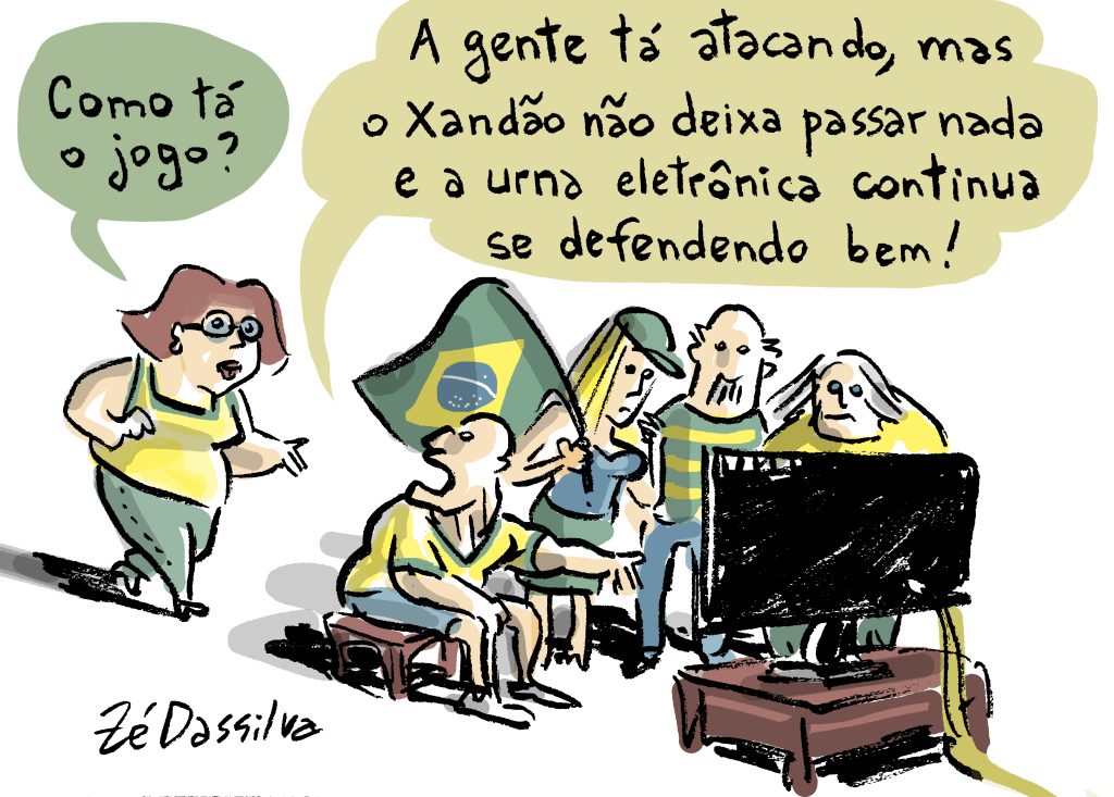 O desenho mostra uma mulher com roupas verde e amarelo, que pergunta, para um grupo que está assistindo ao jogo do Brasil da Copa na televisão, "Como tá o jogo?", o grupo responde "a gente tá atacando, mas o xandão não deixa passar nada e a urna eletrônica continua se defedendo bem!"