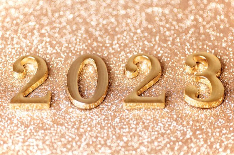 Ilustração dos números 2023 em um fundo com glitter