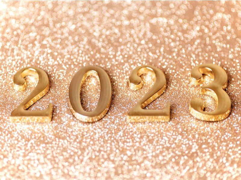 Ilustração dos números 2023 em um fundo com glitter