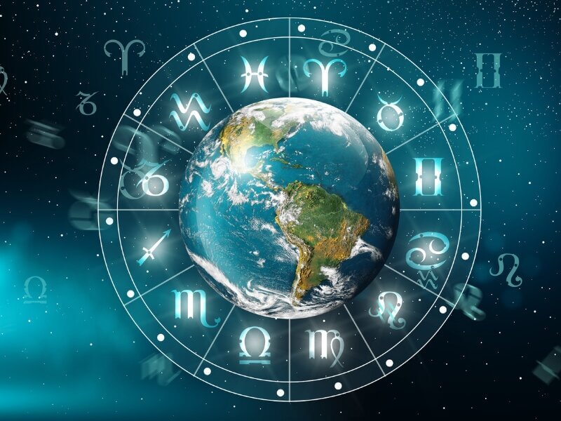 Ilustração do planeta Terra dentro de um circulo com os 12 signos do zodíaco