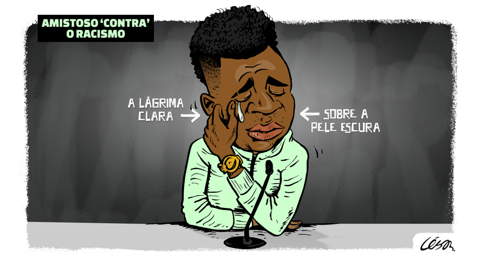 Amistoso "contra" o racismo (Charge: César Cartum)