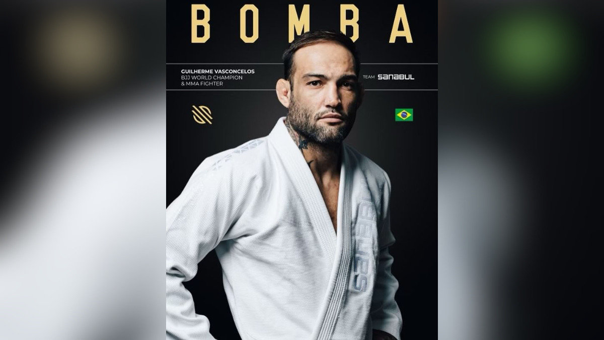 Um lutador de Jiu-Jitsu, Guilherme Vasconcelos, também conhecido como “Bomba”, usando um kimono branco com o logotipo de sua equipe, é destacado em um pôster promocional. A imagem o mostra com uma expressão confiante, cabelo curto e barba. A bandeira do Brasil e seu nome estão no canto inferior direito