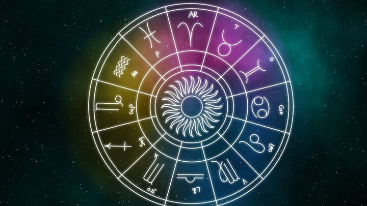 círculo branco com símbolo dos 12 signos e fundo escuro brilhante