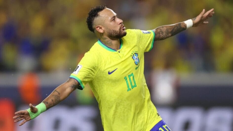 Imagem mostra Neymar com a camisa amarela da seleção brasileira e de braços abertos