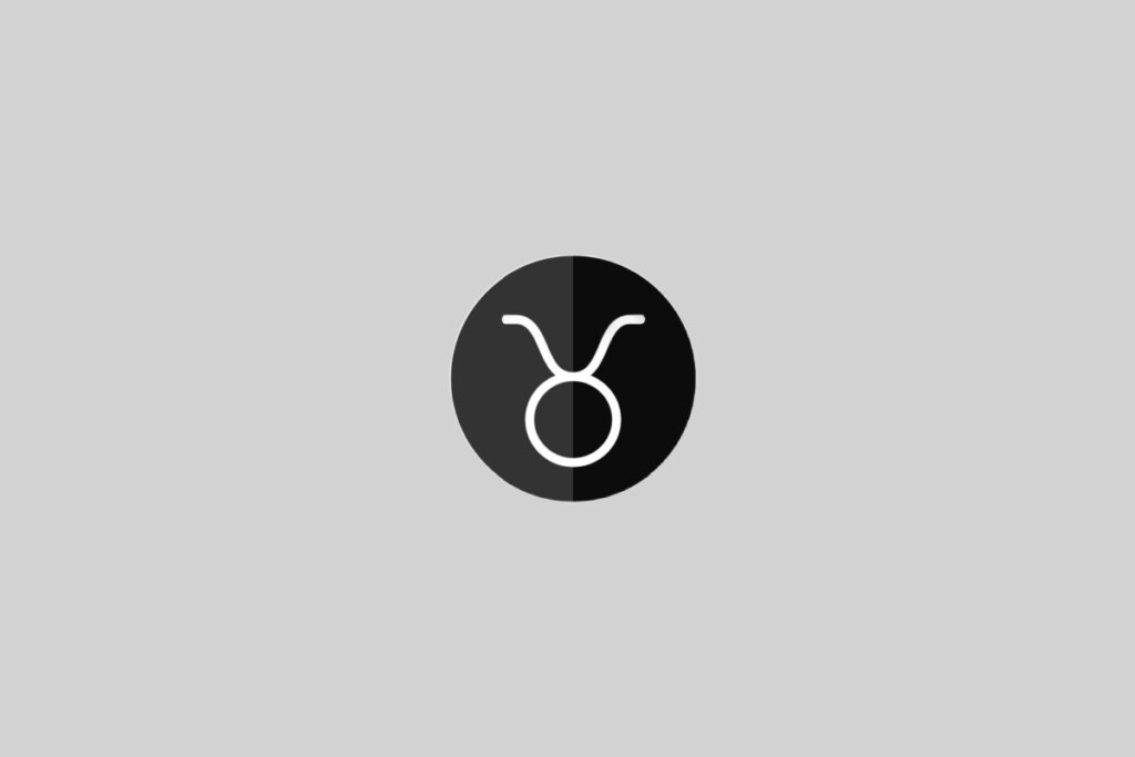 Ilustração do signo de Touro, contendo um cÃrculo com dois traços curvos no topo representando os chifres, em cÃrculo bicolor (preto e branco) em fundo cinza