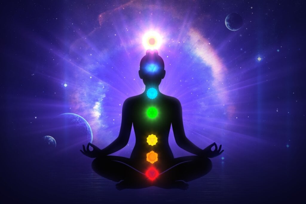 Ilustração de uma pessoa meditando com cÃrculos coloridos em cima dela