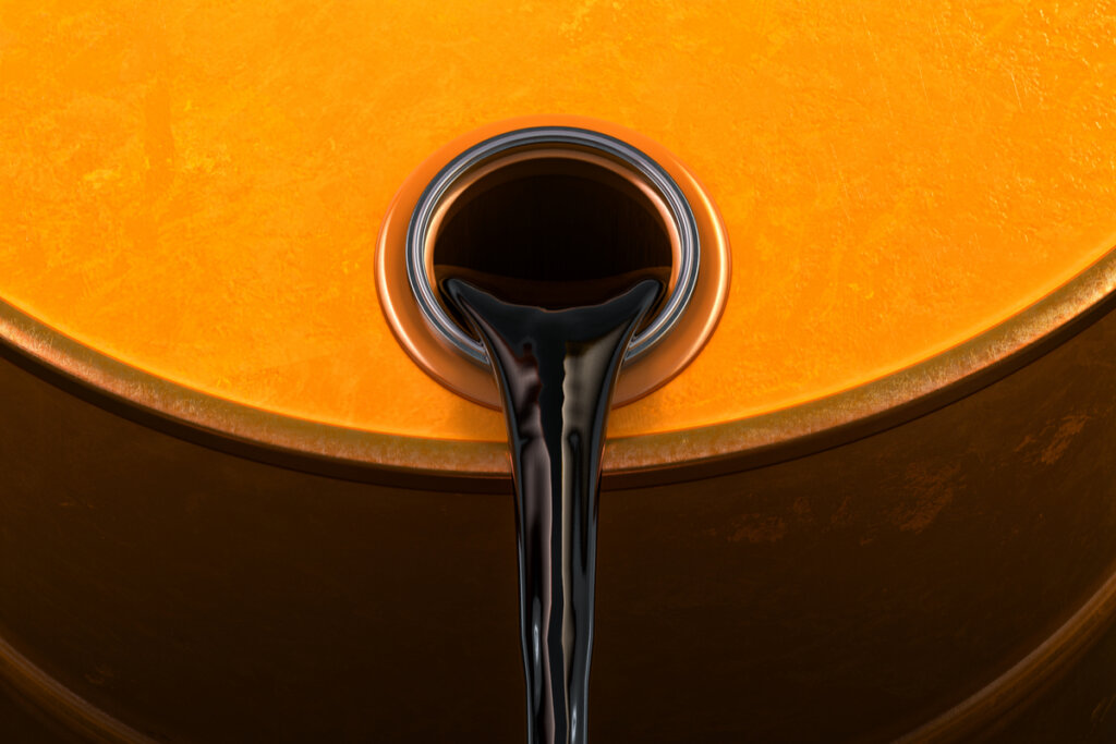 Barril amarelo derramando petróleo
