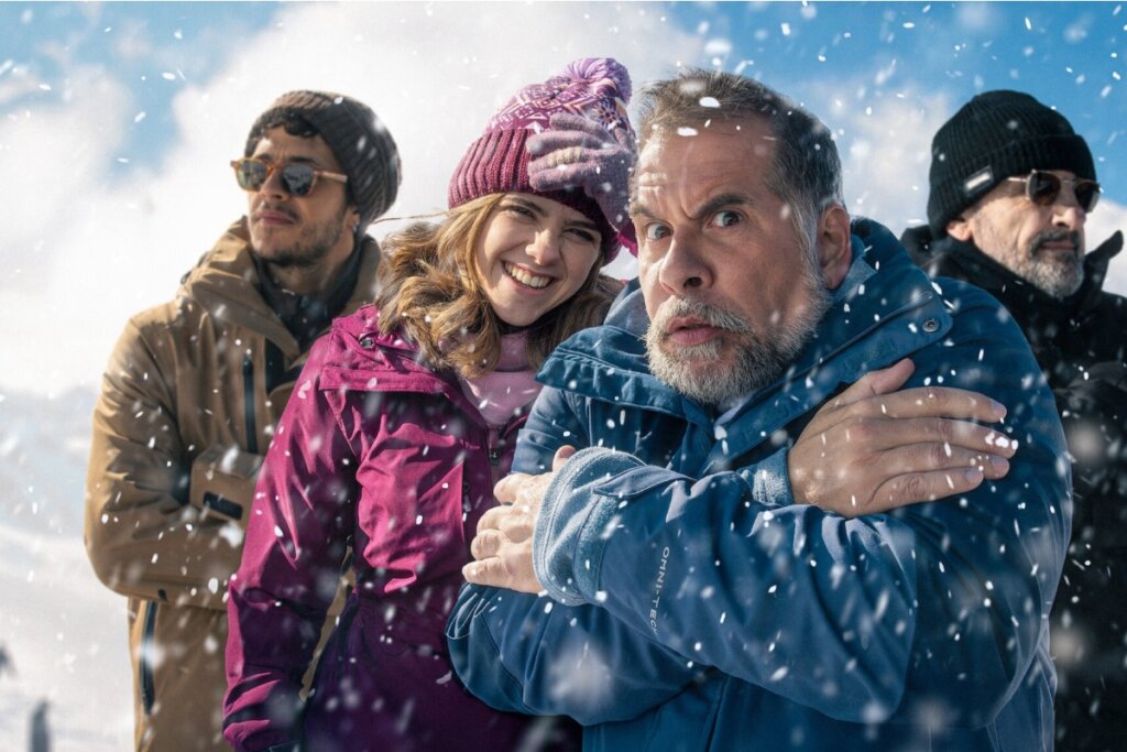 Ilustração de uma famÃlia na neve, com quatro pessoas vestindo roupas de frio