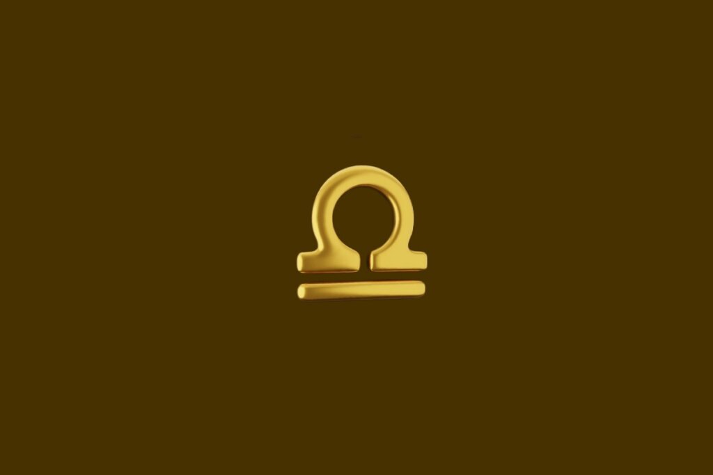 Ilustração do símbolo do signo de libra dourado em um fundo marrom