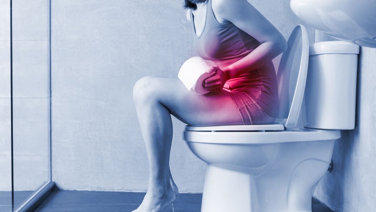 Uma silhueta humana com a região abdominal iluminada em vermelho (sinalizando inflamação/bloqueio).