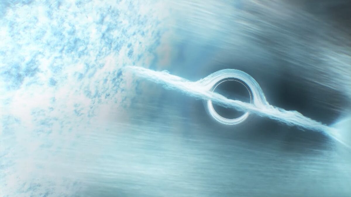 Buraco negro rodeado por disco de acre&ccedil;&atilde;o brilhante puxando mat&eacute;ria de uma estrela pr&oacute;xima.