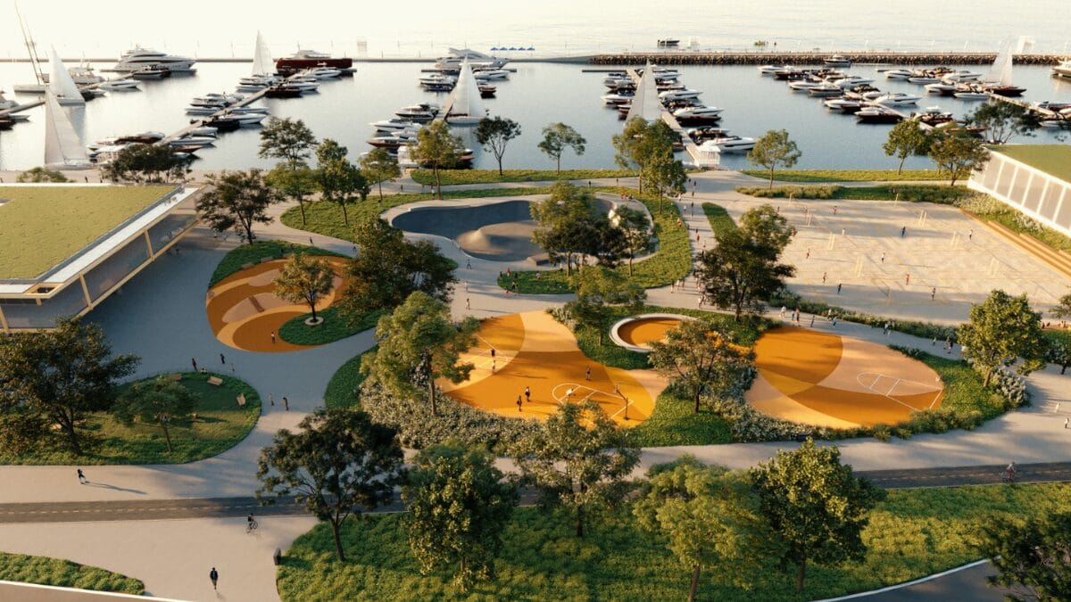 Vista a&eacute;rea do projeto com quadras de areia, caminhos sinuosos, &aacute;reas de lazer e marina ao fundo.
