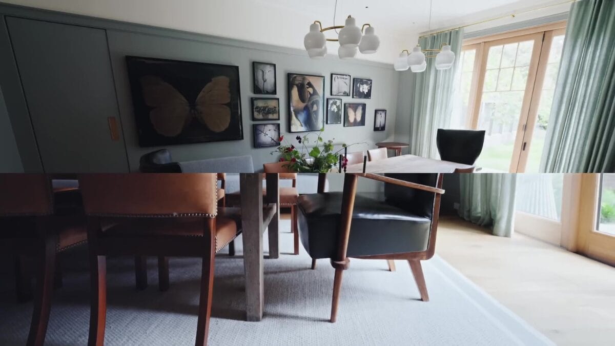Sala de jantar com paredes esverdeadas decoradas com galeria de quadros emoldurados e painel de borboleta, mesa de jantar de madeira com cadeiras estofadas em primeiro plano.