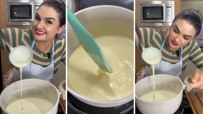Cozinheira mostrando o ponto perfeito do molho bechamel na colher
