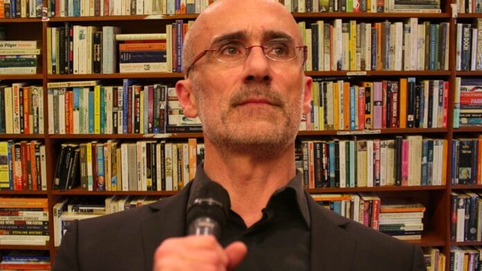 Arthur C. Brooks speaking with attendees at an event titled "The Conservative Heart: How to Build a Fairer, Happier, and More Prosperous America" hosted by the ASU Center for Political Thought & Leadership at the Desert Botanical Garden in Phoenix, Arizona.